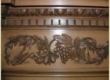Detail of carved vine and foliage on special order mantelpiece