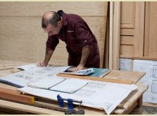 A Hallidays' craftsman working on hand-crafted designs