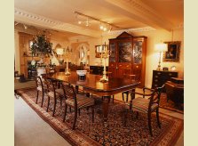A mahogany glazed break-front bookcase and display cabinet with19th century mahogany dining table, chairs and wine cooler